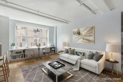 Beautifully gut-renovated two-bedroom, one-and-a-half bath apartment with wall of 9 south-facing windows and 1 west-facing window at 60 Gramercy Park North. The entry foyer opens into a windowed chef's open-style kitchen and a breakfast bar with seat...