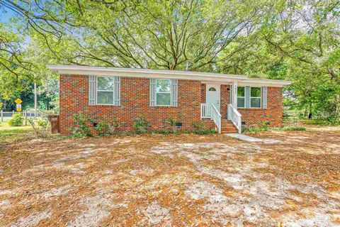 Discover this charming 3-bedroom, 2- bathroom brick home positioned on a generous half-acre lot located in the Medical District in Milton. This property offers an ideal setting for both relaxation and entertaining. As you enter the home, you are gree...