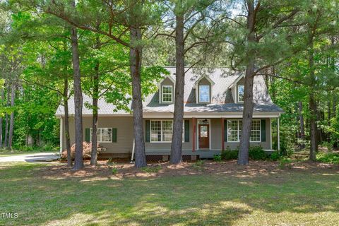 Charming Southern Styled home is nestled amidst a lovely mix of trees providing ample shade and creating a more energy efficient home. A deep front yard and expansive driveway guides you to a 2-car attached side load garage offering an abundance of v...