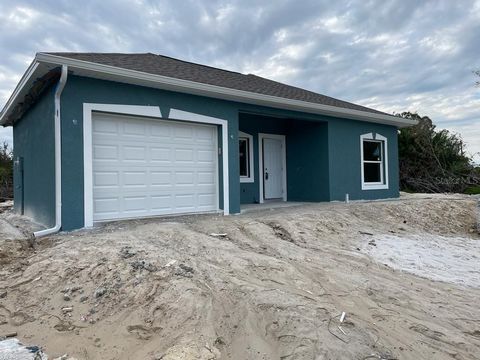 Pre-Construction. To be built. IMPACT WINDOWS THROUGHOUT!! This captivating block home residence nestled in the heart of South Punta Gorda Heights has vinyl luxury plank flooring throughout emanating timeless elegance and offering a serene living exp...