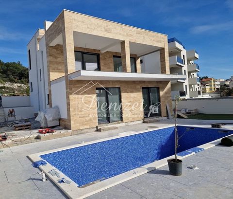 Beautiful modern villa under construction in Okrug Gornji, near Trogir is for sale. The villa has three floors: basement, ground floor and first floor. The villa is located on a plot of 474 m2. The total net area of the villa is 295 m2 (interior spac...