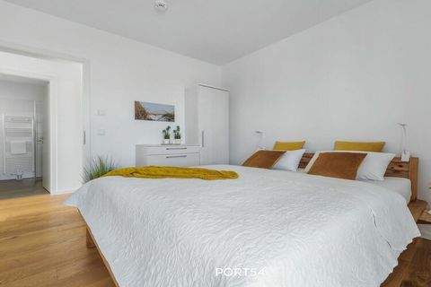 Equipped with real wood parquet, the barrier-free apartment (78 sqm + 17 sqm balconies) with underfloor heating offers two bedrooms and a bathroom as well as a very well-equipped kitchen, which borders the living and dining area. The bedrooms are equ...