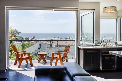 Step into this beautifully designed home where modern elegance meets coastal charm. The open floor plan seamlessly integrates indoor and outdoor living, perfect for entertaining or simply enjoying the serene ocean breezes. The spacious living area fe...