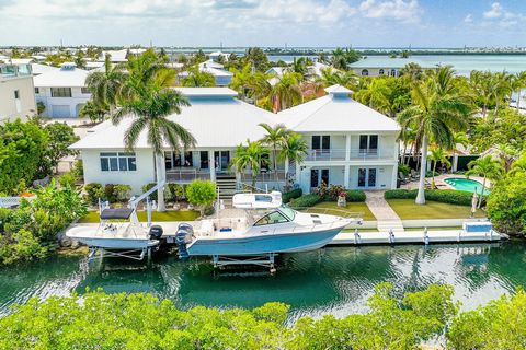 LUXURY LIVING IN THE LOWER KEYS where the pace of life is a bit slower, and the fishing and diving are exceptional. The 16,875 sq. ft. property features 150 ft. of frontage along a 46 ft. wide canal, a 50 ft. concrete dock, and two boat lifts (the la...