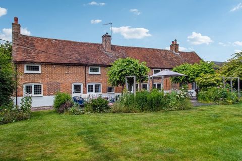 A fine example of a GII listed period home with an intimate warmth and welcome feel, a wealth of period features including exposed oak beams, inglenook fireplaces and slate floors, situated in an enclosed plot of 0.18 of an acre. The property sits be...