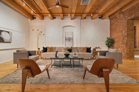 Discover luxury living in Boston's Seaport at Fort Point Place. This loft-style 1-bed, 1-bath condo offers 1791 sq. ft. of sophisticated space and boasts a harmonious blend of classic brick-and-beam aesthetics and modern amenities. The expansive inte...