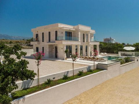 Magnificent new villa in Novalja, Pag - perfect solid building of original architecture. Villa benefits fantastic open sea views! Total area is 350 sq.m. Land plot is 350 sq.m. It has 5 bedrooms, 6 bathrooms, gorgeous salon with modern kitchen, wonde...