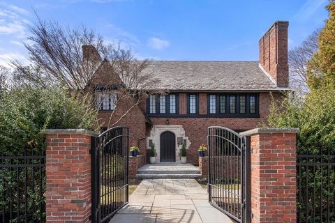 Nestled on a sprawling Chestnut Hill estate, this meticulously renovated 1926 Tudor melds storybook charm and modern luxury. Brimming with natural light, the open kitchen features high ceilings, custom cabinets, marble counters, Hudson Valley Lightin...