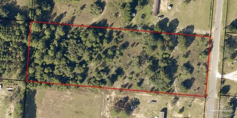 3.10 acres of vacant land, south of I-10 in Milton.
