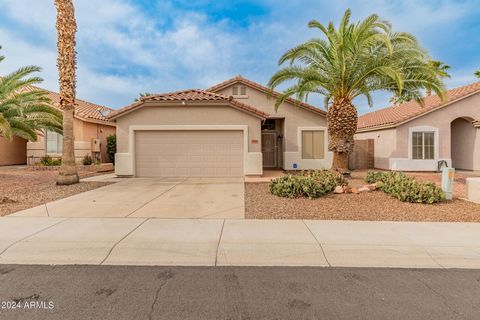 This beautiful home located in the heart of Surprise has been well taken care of and shows off countless upgrades. 100% wood look tile floors throughout the entire home no carpet at all, granite countertops and tile backsplash in the kitchen and bath...