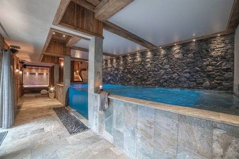 Chalet located in Val d'Isère. With a total surface area of 700 m2, including 550m2 of living space, this Chalet can accommodate 14 guests in its seven en-suite bedrooms and its large open-plan living space. It has a fitness room, a wellness area wit...