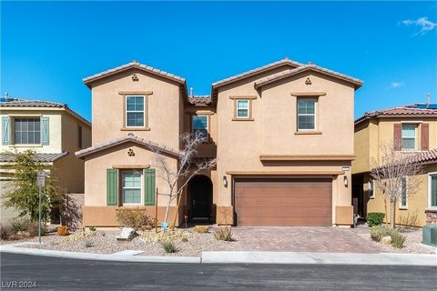Beautiful home in a gated SW community with two primary bedrooms, one upstairs and one downstairs! A rare find! Massive kitchen w/ TWO islands, gleaming white cabinetry, granite counters, custom glass tile backsplash, GE Profile appliance package inc...