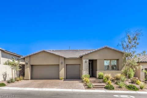 Modern luxury in Summerlin West's gated Savannah at Red Point. This 3-year-old masterpiece boasts 3 bedrooms, 2.5 baths, a den, and a 3-car garage. The owner's suite is a tranquil retreat with a walk-in closet and a spa-like bathroom. An open floor p...