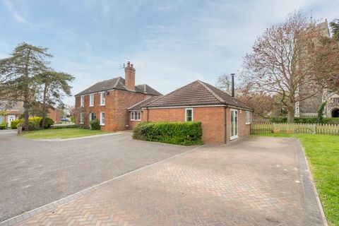 A handsome Georgian home looking out over the pretty Grade II* listed village church, tucked away on a quiet road close to the village green and duck pond – it’s very easy to see the appeal of this attractive property! It’s been recently and sympathe...