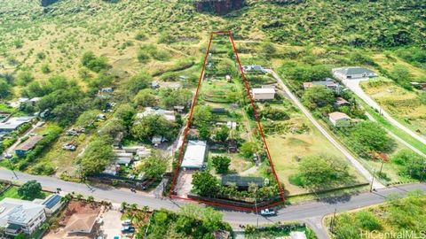 Embrace the opportunity to own a sprawling piece of land on the picturesque west side of Oahu, boasting a boat home and a single-family residence awaiting your personal touch. With stunning views all around and endless possibilities, this property of...