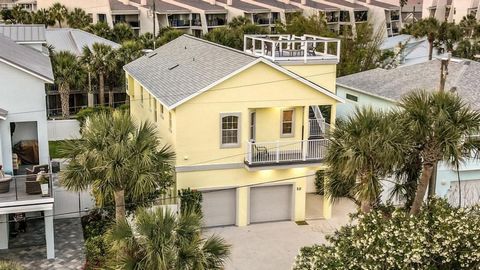 Welcome to coastal living at its finest on the prestigious ''Golden Mile'' of St. Augustine Beach. This stunning 5-bedroom, 4-bathroom home boasts over 2600 square feet of living space spread across two stories, offering ocean views and over 1900 squ...