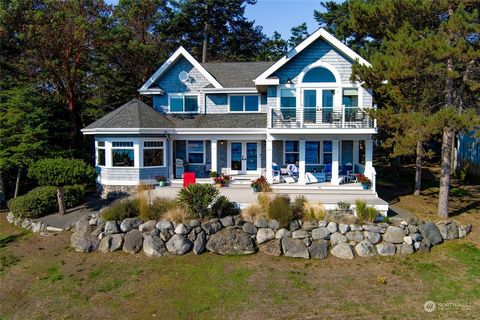 Excellent quality east-facing Cape Cod with a low-bank gravel and sand beach at Cape San Juan with 2557 sf, 3 bedrooms, 3.5 baths, newly updated kitchen, with Cambria quartz countertops, and bathrooms, many built-ins, two propane fireplaces, Brazilia...