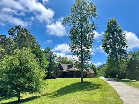 Experience luxury living with this stunning home nestled on over 2 acres of land, boasting 3 bedrooms, 2 1/2 baths, an exquisite eat-in kitchen, with granite countertops, stainless steel appliances and 2 additional finished rooms upstairs. The expans...