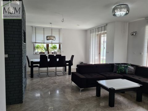 The object of sale is a two-storey detached house built according to the Tukan design. The house is located on a plot of 924 m2 in a quiet area, among a newly built housing estate. Building from 2019. The property has a usable area of 165 m2: - on th...