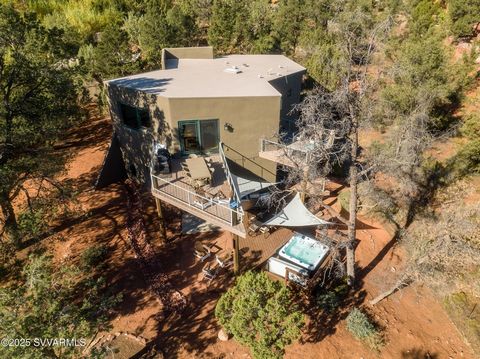 Stunning Contemporary Retreat in the Heart of Sedona. Whether you're looking for a thriving vacation rental or your serene dream home, this custom contemporary escape is designed to match your vision. Nestled in Sedona's breathtaking landscape, it of...